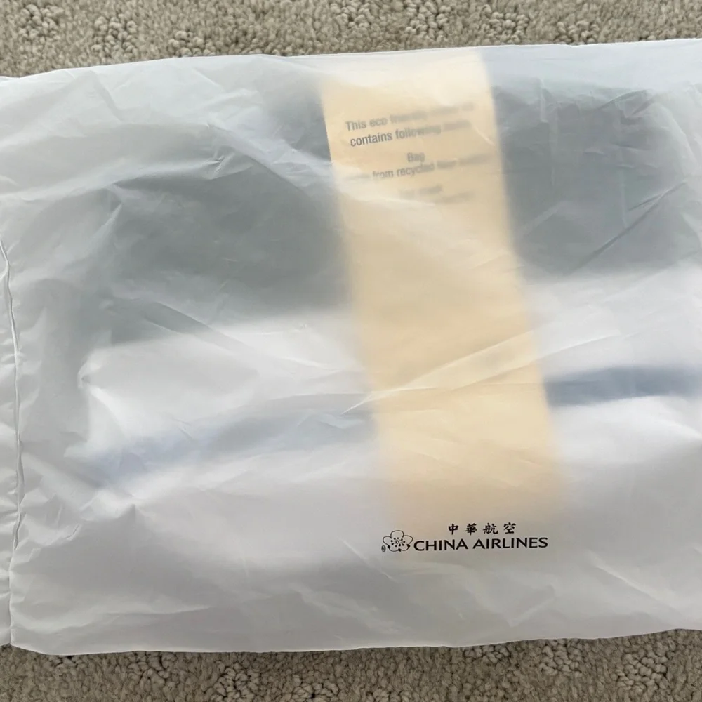 Roots x China airline amenity kit with Moroccan oil products